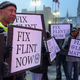 Demonstrators demand action about the water crisis in Flint, Mich., outside the Fox Theater in Detroit before the GOP presidential debate March 3, 2016. (Chip Somodevilla/Getty Images)